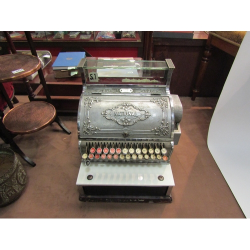 4200 - An NCR National Cash Register, model 348, serial no, 1014531 (date 1911). Nickel-plated case, dogwoo... 