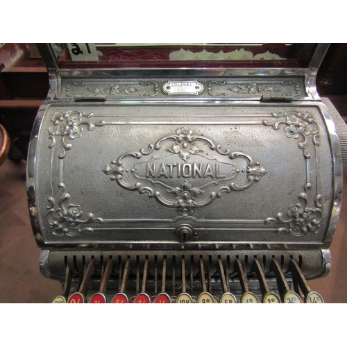 4200 - An NCR National Cash Register, model 348, serial no, 1014531 (date 1911). Nickel-plated case, dogwoo... 