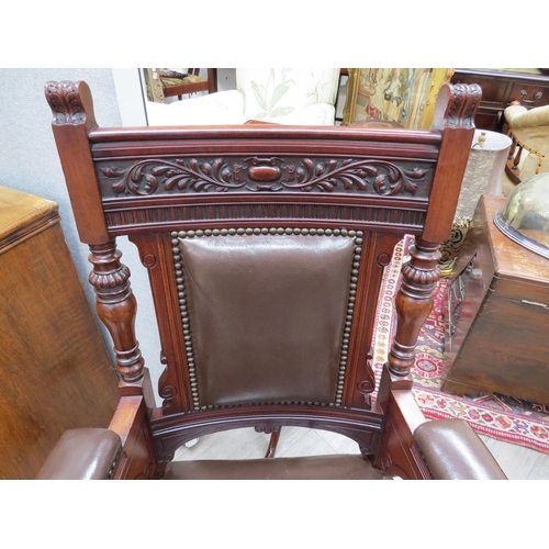 4199 - A Circa 1890 carved and turned walnut armchair with leather upholstery and brass stud borders, 108cm... 