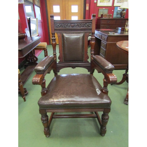 4199 - A Circa 1890 carved and turned walnut armchair with leather upholstery and brass stud borders, 108cm... 