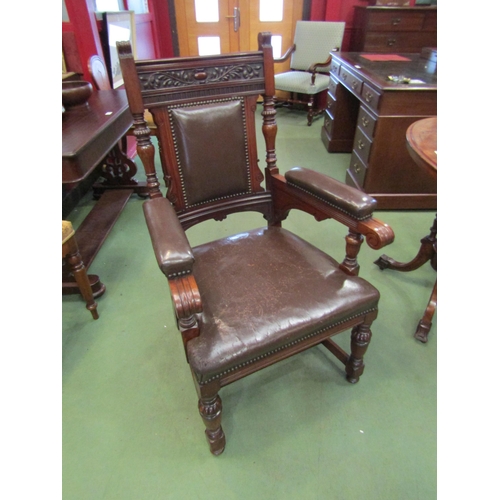 4199 - A Circa 1890 carved and turned walnut armchair with leather upholstery and brass stud borders, 108cm... 