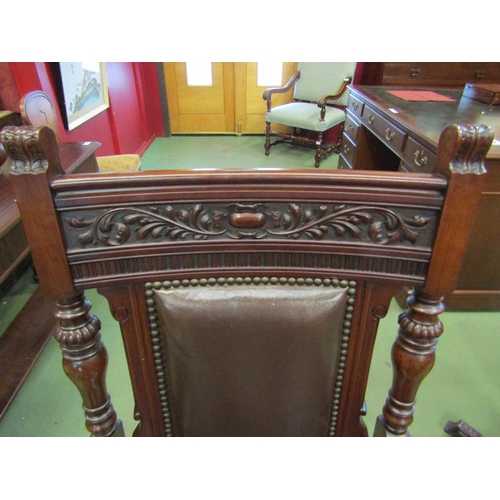 4199 - A Circa 1890 carved and turned walnut armchair with leather upholstery and brass stud borders, 108cm... 