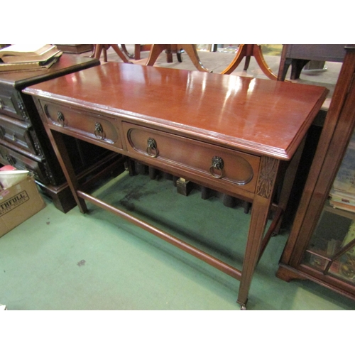 4197 - A Georgian mahogany serving table the two frieze drawers with brass lion-mask ring handles over carv... 