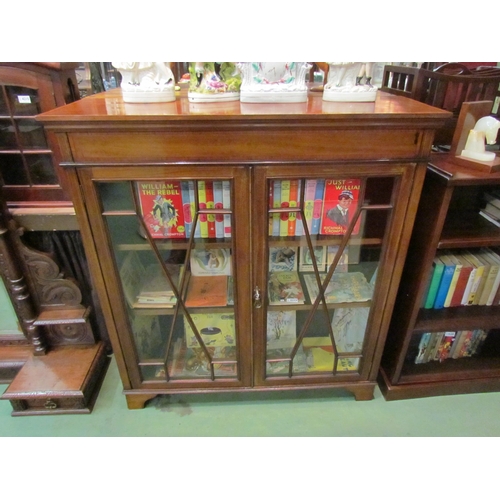 4192 - An Edwardian crossbanded mahogany bookcase the two astragal glazed doors with working key and height... 