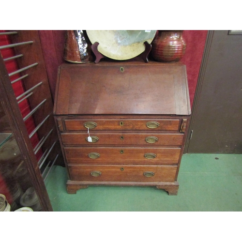 4185 - A George III oak bureau, the fall front over four graduating long drawers, bracket feet, 104cm tall ... 