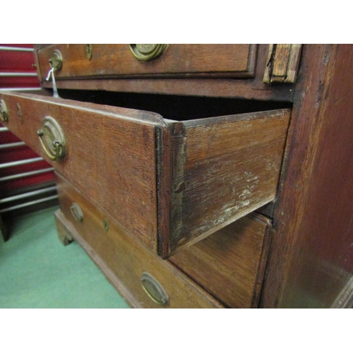 4185 - A George III oak bureau, the fall front over four graduating long drawers, bracket feet, 104cm tall ... 