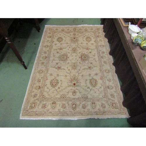 4003 - A wool rug decorated with flowers, cream ground, 178cm x 118cm