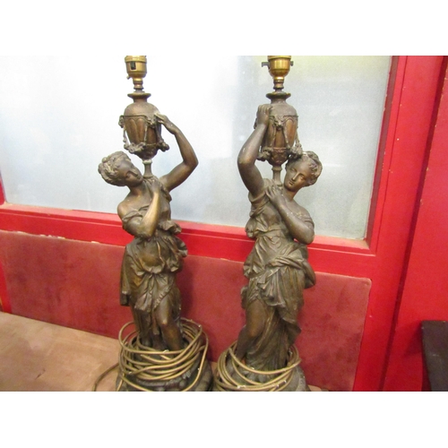 4009 - A pair of cast metal classical female figures converted to electric lamps, 62cm tall