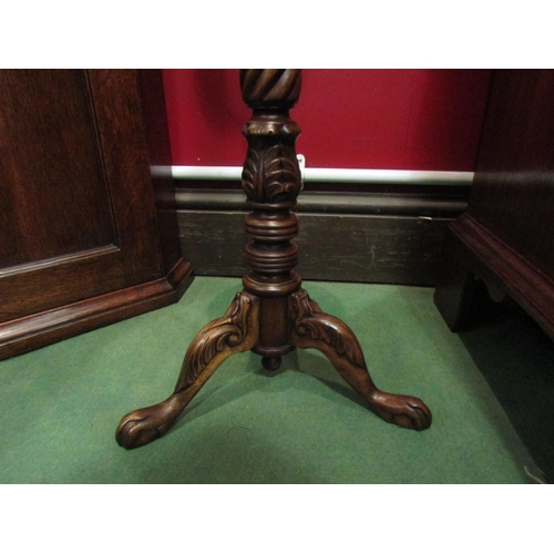 4044 - A George II style walnut candle stand, the dished circular top over a tapering spiral, turned and ca... 