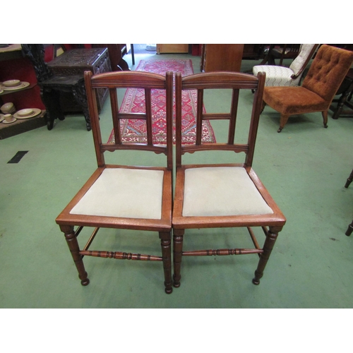 4065 - A pair of late Victorian Arts & Crafts walnut chairs attributed to 