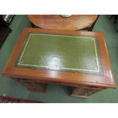 4069 - An early 20th Century twin pedestal desk, nine drawers, green tooled leather insert top, 77cm x 90cm... 