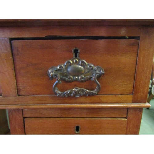 4069 - An early 20th Century twin pedestal desk, nine drawers, green tooled leather insert top, 77cm x 90cm... 