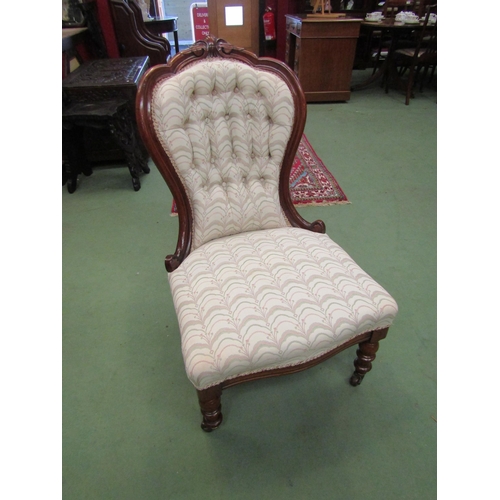 4070 - An Arts & Crafts oak open armchair with carved decoration over turned fore legs and ceramic castors