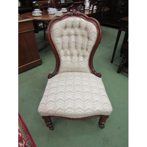 4070 - An Arts & Crafts oak open armchair with carved decoration over turned fore legs and ceramic castors