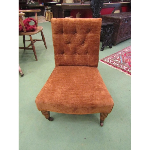 4071 - A circa 1900 walnut armchair the button backrest over turned and square tapering legs with reeded de... 