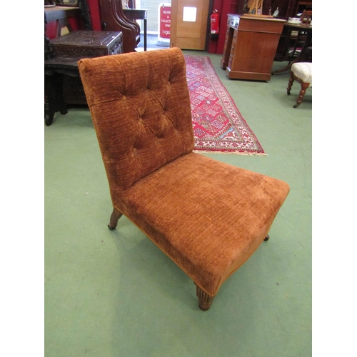 4071 - A circa 1900 walnut armchair the button backrest over turned and square tapering legs with reeded de... 