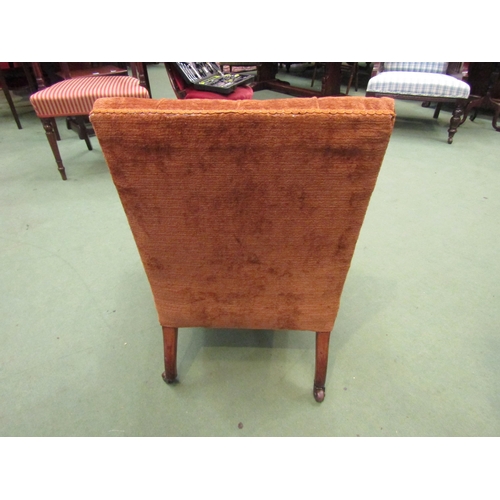 4071 - A circa 1900 walnut armchair the button backrest over turned and square tapering legs with reeded de... 