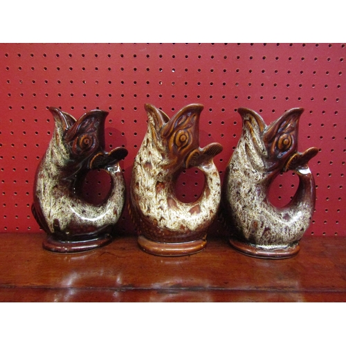 4090 - Three Fosters Studio Cornwall gluggle jugs, all approximately 20cm tall