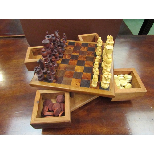 4093 - A wooden chess and draughts set, 18cm x 18cm