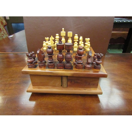 4093 - A wooden chess and draughts set, 18cm x 18cm