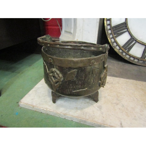 4145 - A brass bucket form jardinière on tripod feet, 20cm tall x 2cm diameter