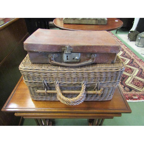 4157 - A wicker basket together with a leather suitcase filled with cooking ephemera, recipes, etc