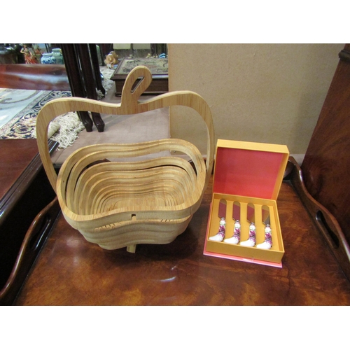 4194 - A collapsible wooden apple shaped basket together with a boxed set of Laura Ashley butter knives   (... 