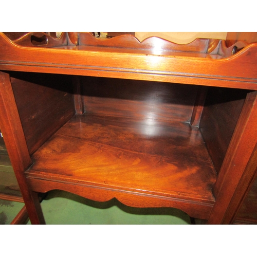 4195 - A George III revival flame mahogany nightstand the galleried top with fret handles over an open shel... 