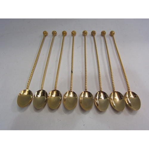 4330 - A set of eight cocktail stirrers in gilded metal with pierced orb finials