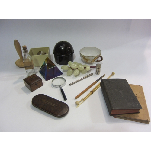 4363 - A collection of mixed items; a Bakelite string holder, magnifying glass, hardstone grapes, etc