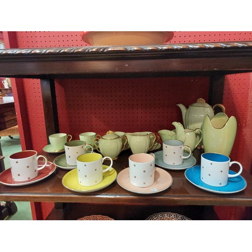 4111 - A set of six Susie Cooper star coffee cups and saucers and a Carlton Ware coffee service