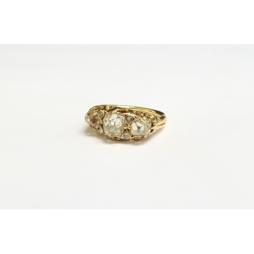 8022 - A late 19th Century diamond ring, three old cut diamond's spaced by two small diamonds, 2ct approx t... 