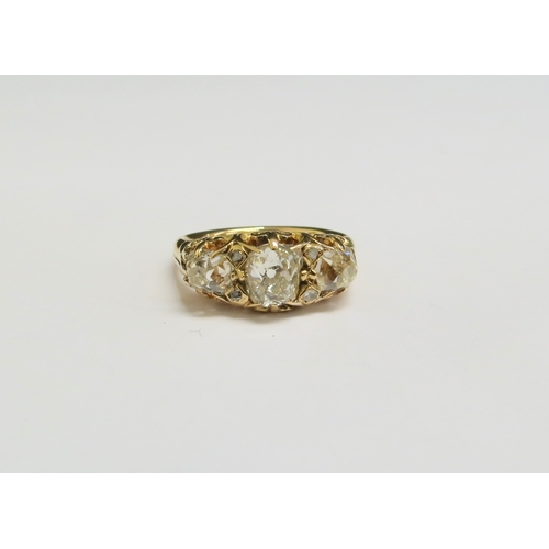 8022 - A late 19th Century diamond ring, three old cut diamond's spaced by two small diamonds, 2ct approx t... 