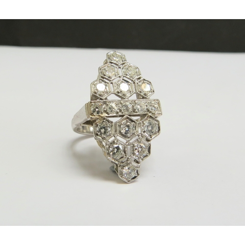 8010 - A platinum ring set with diamonds in milgrain honeycomb design, the centre with a row of diamonds. S... 