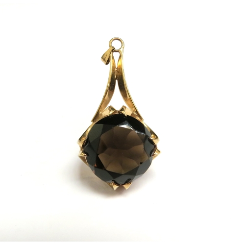 8045 - A 9ct gold pendant set with a large circular smoky quartz, 4.5cm long, 6.5g   (E) £30-50