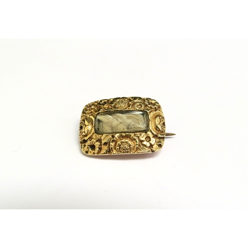 8071 - A Victorian hair panel brooch with embossed decoration, reverse inscribed Catherine Matchett ob.21 F... 