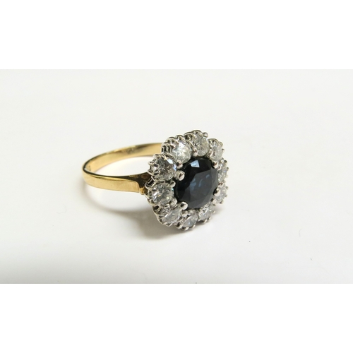 8014 - An 18ct gold sapphire and diamond cluster ring, 13mm diameter, 1ct total approx. Size M/N, 4.4g   (C... 