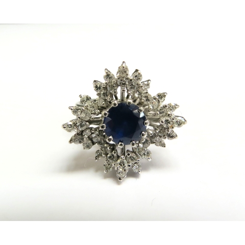 8003 - A white gold sapphire and diamond cluster ring, unmarked. Size K, 7.2g   (C)