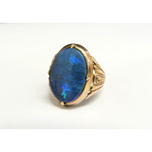 8066 - A gold oval opal doublet ring, stamped 14k. Size J/K, 4.7g