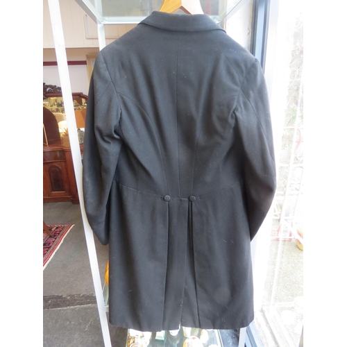 1046 - A gents bespoke black frock coat with silk buttons and lapel