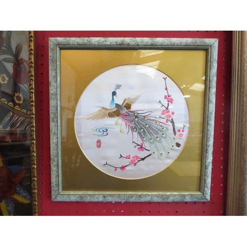 1114 - A 20th Century Chinese silk embroidery of birds and floral sprays, blue ground, 60cm x 23cm, framed ... 