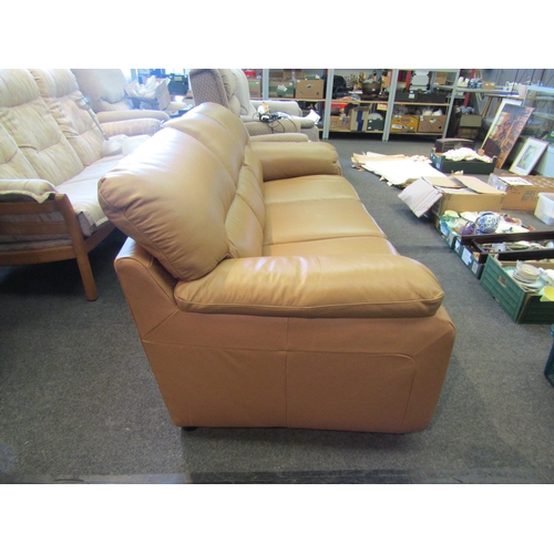 1146 - A butterscotch leather three seater sofa            (R) £30