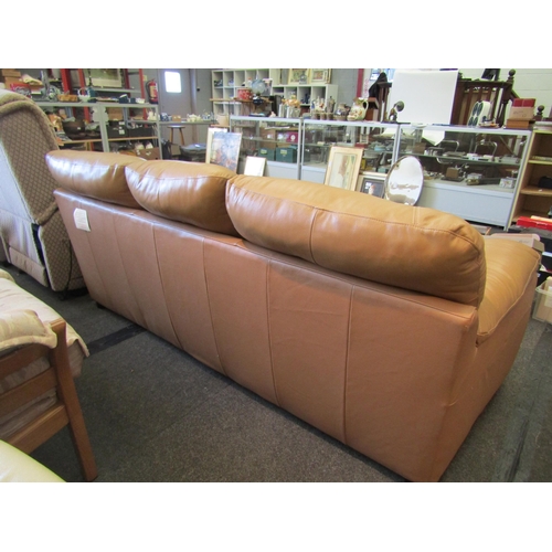 1146 - A butterscotch leather three seater sofa            (R) £30