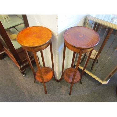 1004 - A pair of Edwardian mahogany jardiniere stands, satinwood strung with shell marquetry centre, with u... 