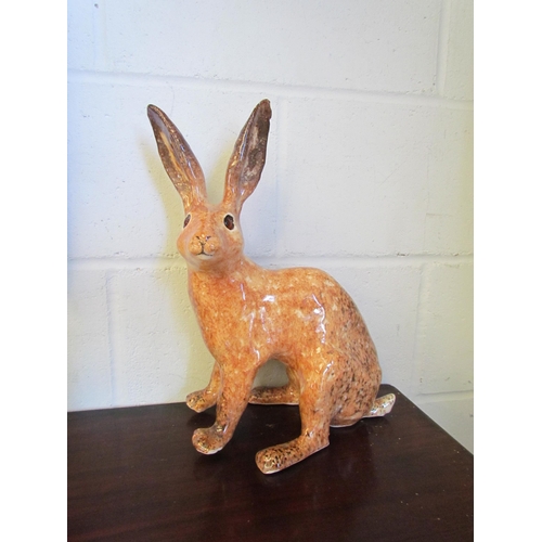 1013 - A Winstanley figure of a brown hare, 38cm tall