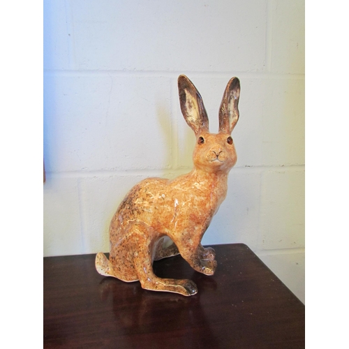 1015 - A Winstanley figure of a brown hare, 40cm tall