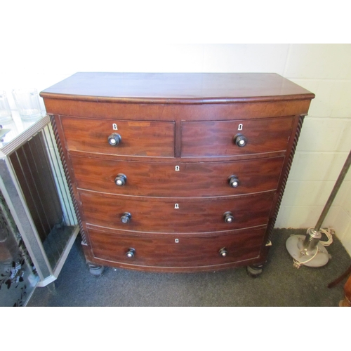 1016 - A Victorian Scottish bow-fronted chest of two short over three long drawers, spiral detail, on turne... 