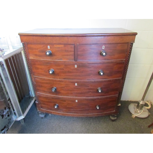 1016 - A Victorian Scottish bow-fronted chest of two short over three long drawers, spiral detail, on turne... 