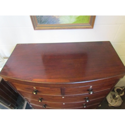 1016 - A Victorian Scottish bow-fronted chest of two short over three long drawers, spiral detail, on turne... 