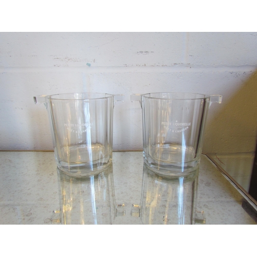 1018 - A pair of small glass Moet & Chandon ice buckets, 13.5cm tall